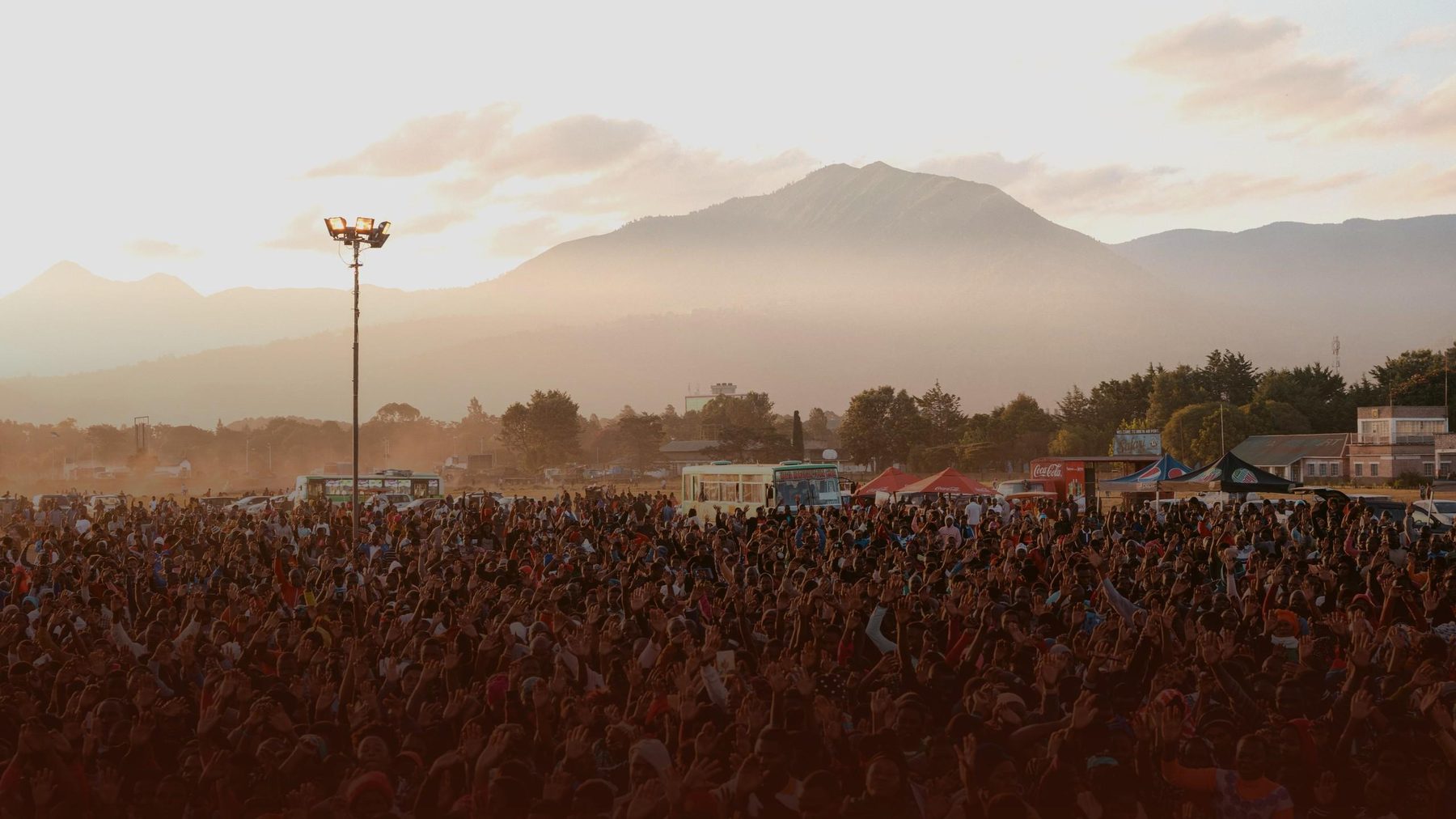 Crowd gathered at a Christ for all Nations crusade at dusk